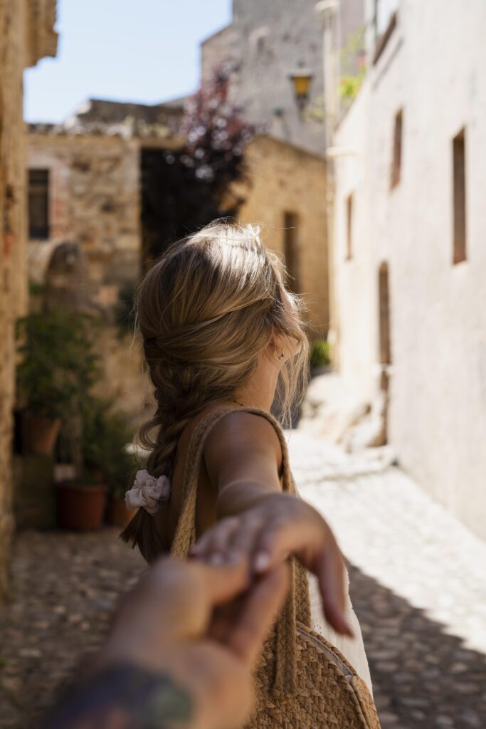 Time to Plan Your Dream Spring Trip to Greece! 4 partners holding hands close up